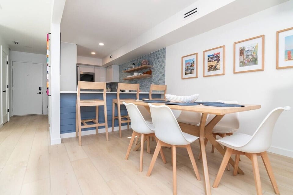 Gather around the dining table for family meals, games, or planning your next beach adventure.