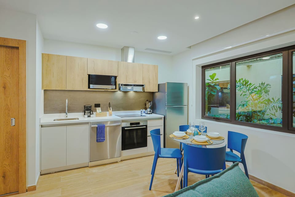 Step into your bright and fully equipped kitchen, where cooking feels effortless with modern appliances, sleek cabinetry, and a cozy dining space perfect for sharing meals together.
