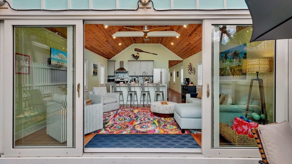 Open the sliding doors to the pool area to create a seamless indoor/outdoor living experience...
