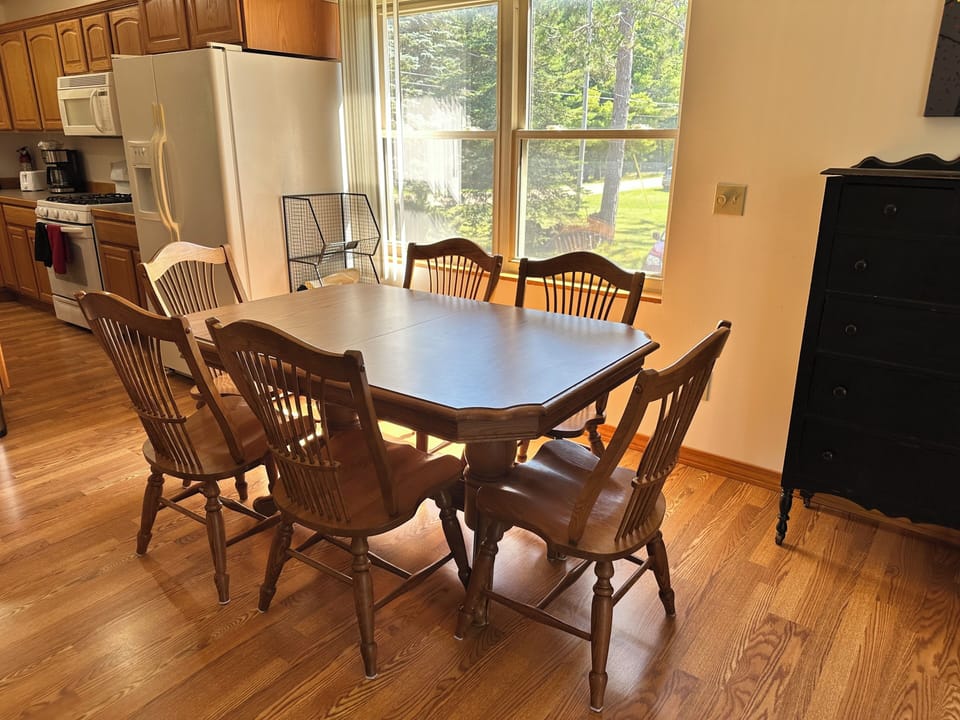 Dining room table and chairs right off the kitchen