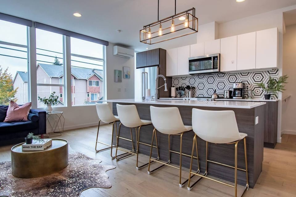 Enjoy large windows in main living space for natural light. Open layout to enjoy both kitchen and living space.