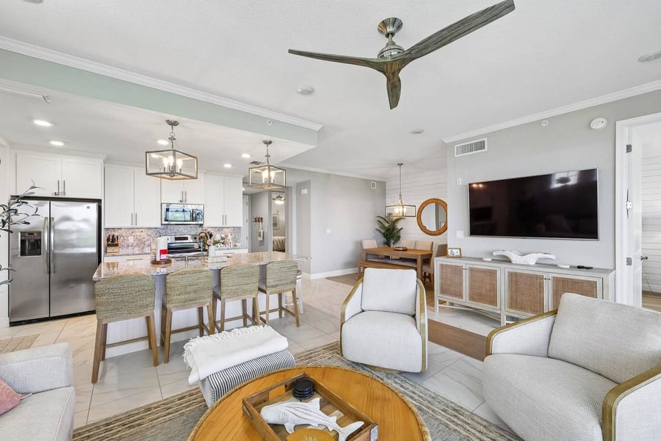 Coastal-modern living room with comfortable seating and smart TV offer many ways to use the space