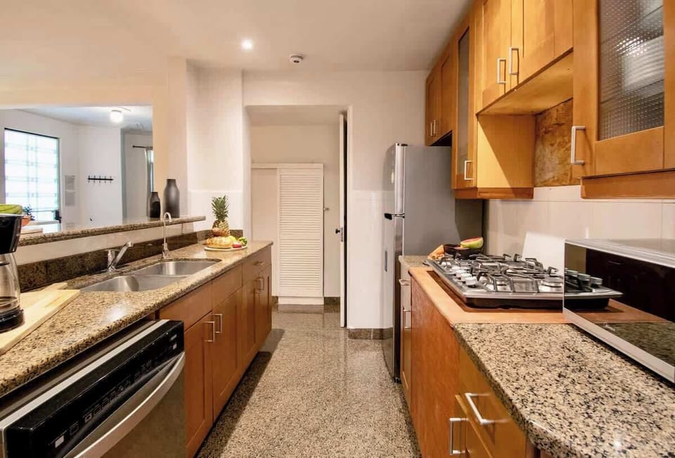 Designed for convenience, the spacious kitchen offers generous counter space, modern appliances, and plenty of room for multiple people to cook together.