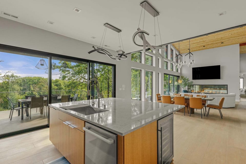 A dream kitchen opening to outside dining with infrared heating for cooler nights and grill. Or dine inside opening up to the dining and living space. 