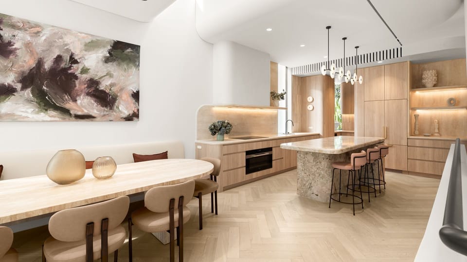 Designer kitchen featuring premium stone benchtops and warm timber cabinetry.