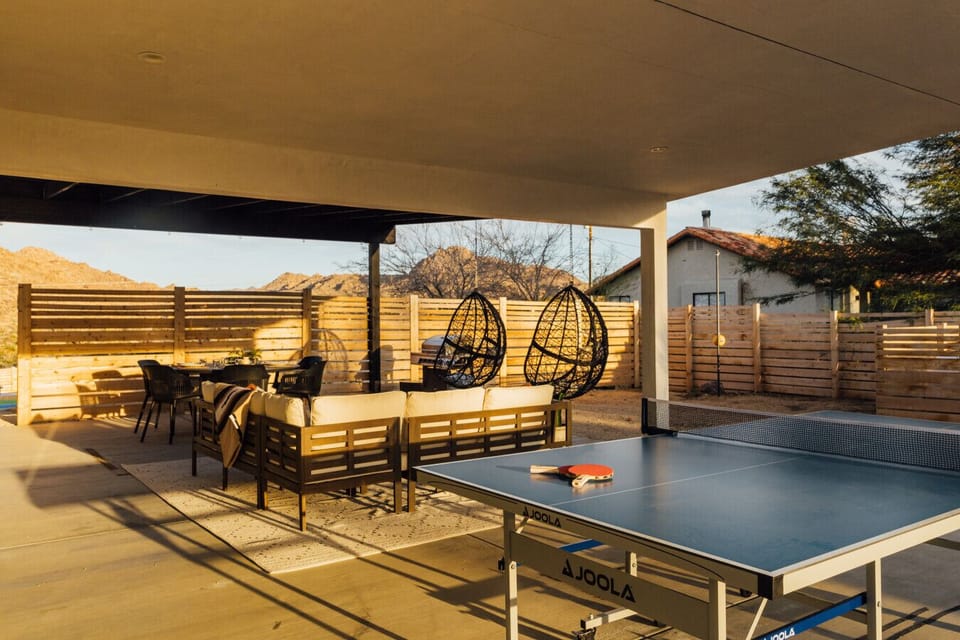 Game, lounge, and dine under the covered patio.