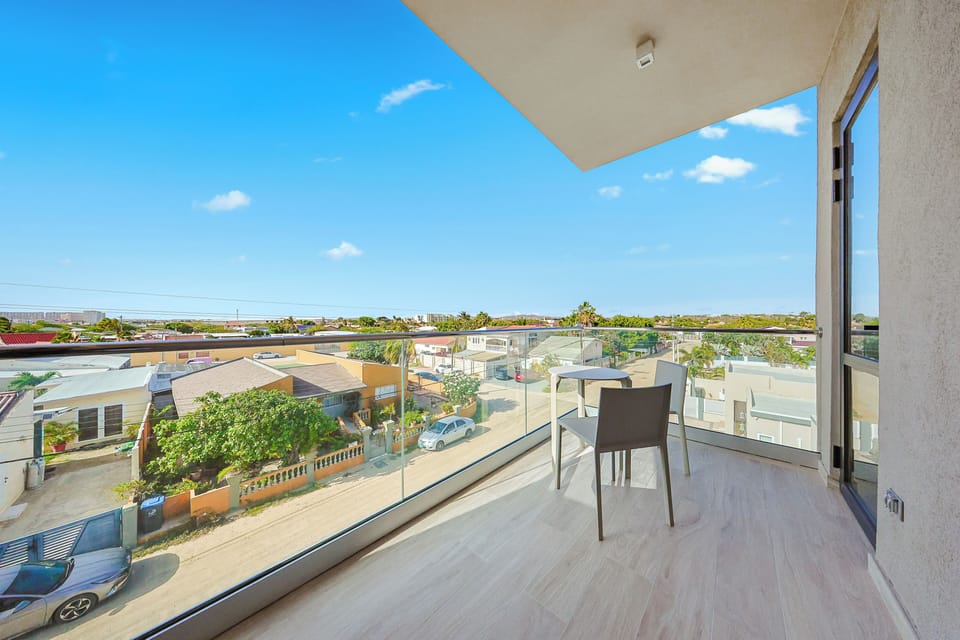 Step out onto your private balcony and soak in the peaceful neighborhood views stretching to the horizon under endless blue skies.