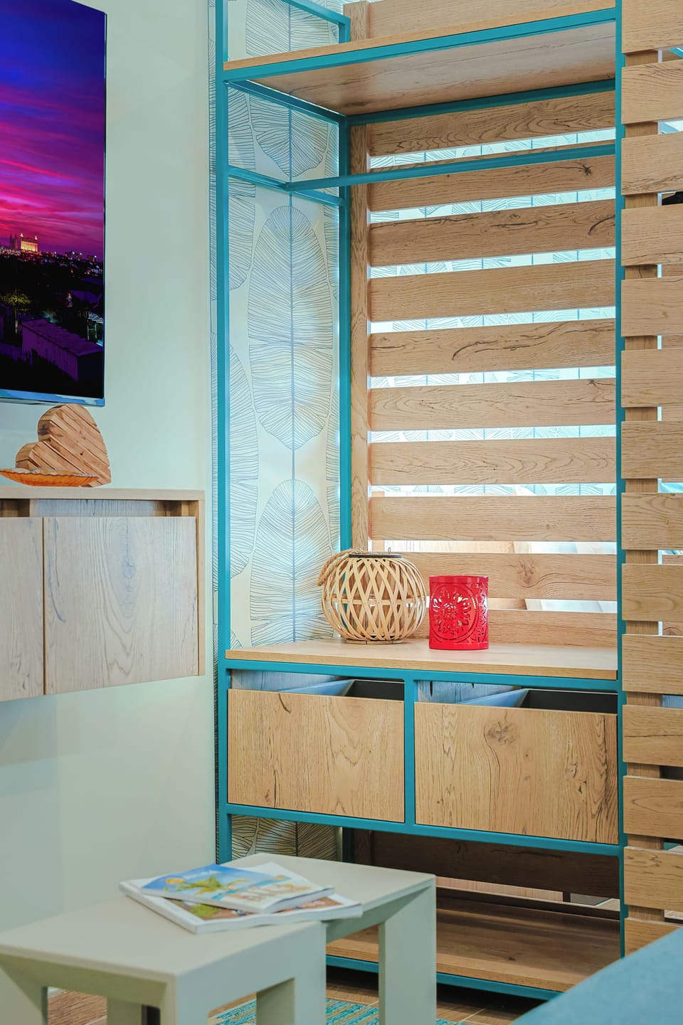 Your cozy retreat features smart storage solutions and artistic touches, with a decorative room divider that brings both style and function to your living space.