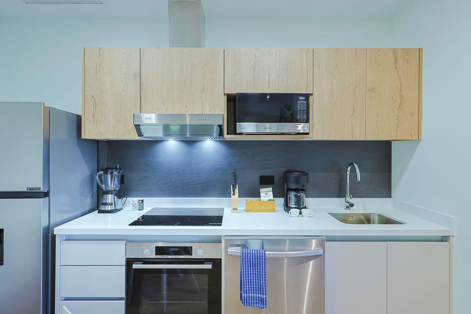 Your modern kitchen comes fully equipped with stainless steel appliances, sleek countertops, and everything you need to cook up a delicious meal during your stay.