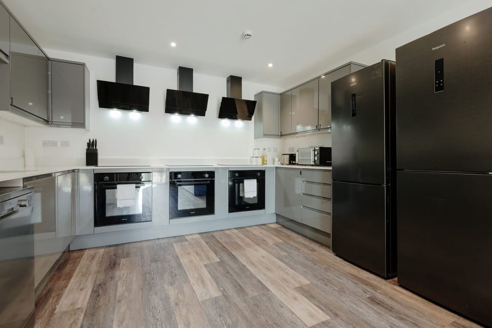 The spacious open plan kitchen and living area includes three cookers and two refrigerators