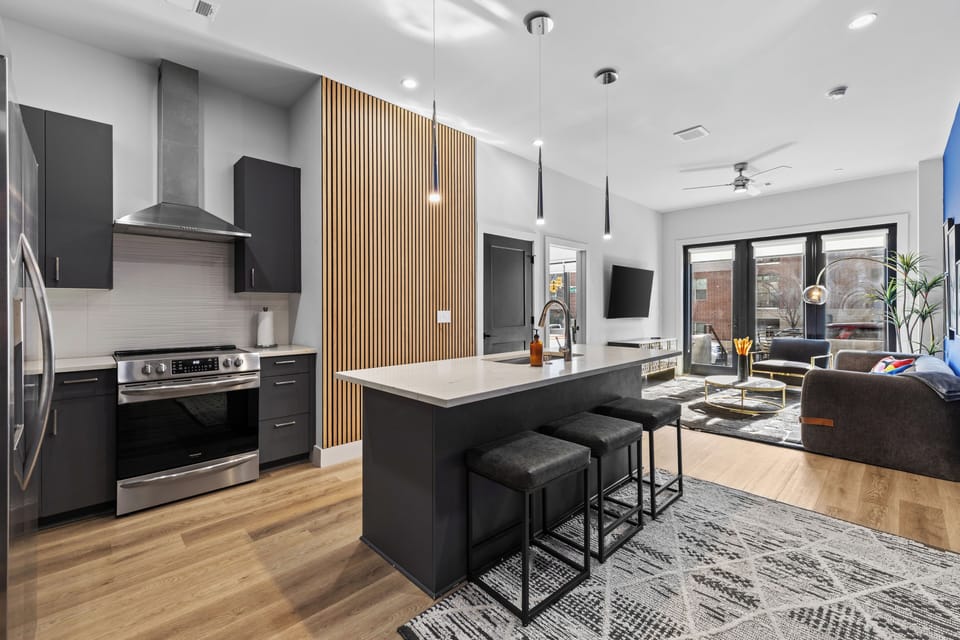 Fully equipped kitchen with island seating and open living space