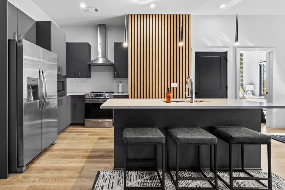 Modern kitchen with large island and stainless steel appliances