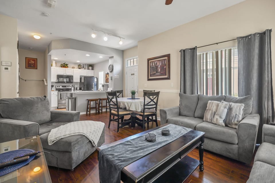 Living room area with dining area that seats 4 people & breakfast bar for 2.