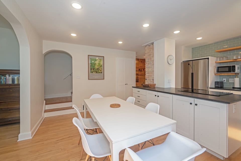 Open concept main floor with dining that flows into the kitchen.