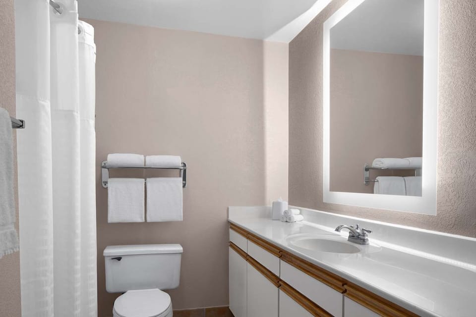 Refresh and reset with a bright vanity and clean towels.