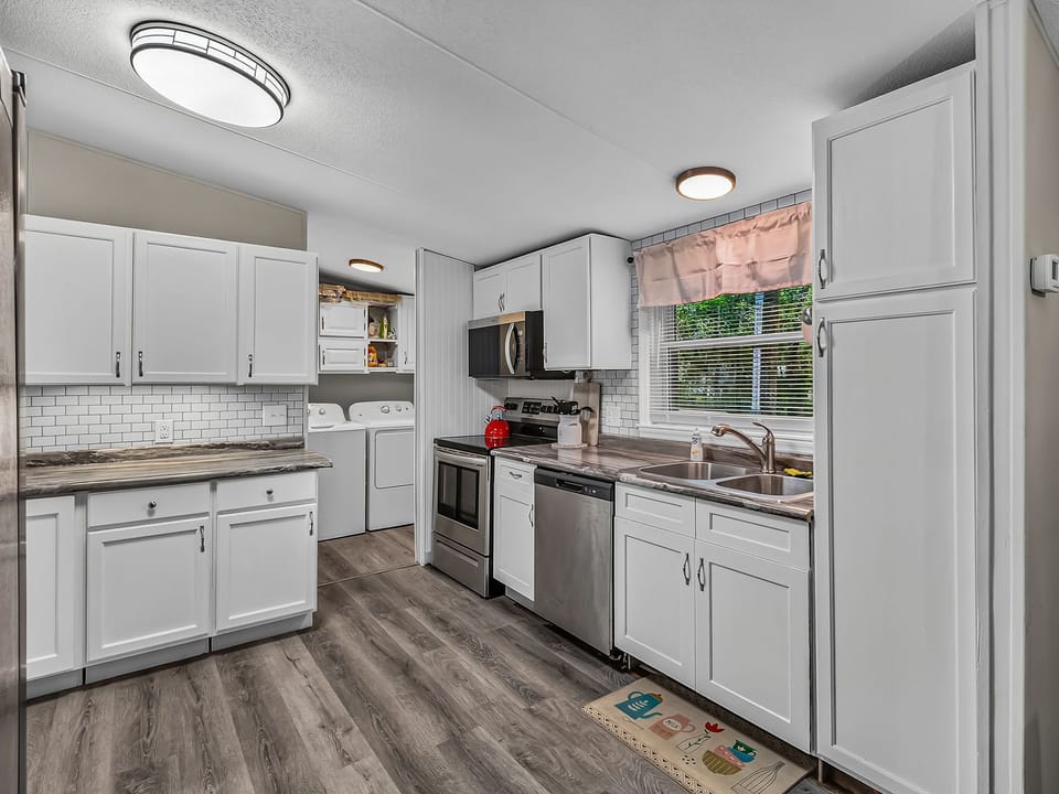 Stainless steel appliances and counter space make meal prep easy in the kitchen.