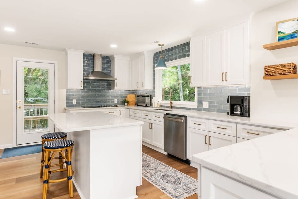The brand-new chef’s kitchen: quartz for days, sea-blue tile, and every tool you need to feed a full house.