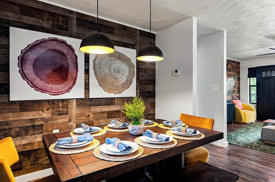 Gather the crew around this farmhouse table — local art and warm wood set the scene for a memorable meal.