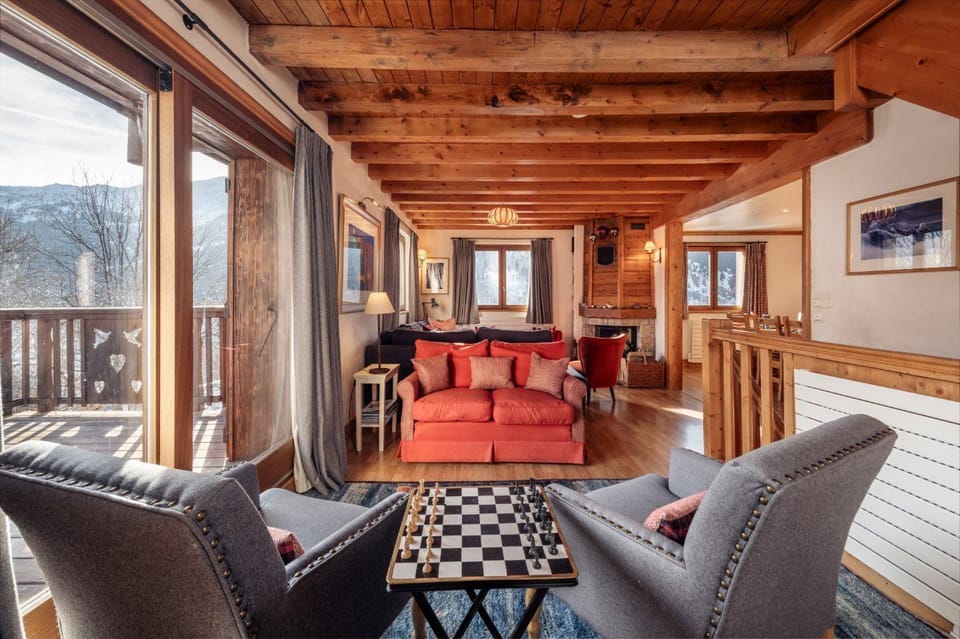 Meribel's Three Valleys ski area is just minutes away from the inviting living space, with wide windows framing the peaks outside.