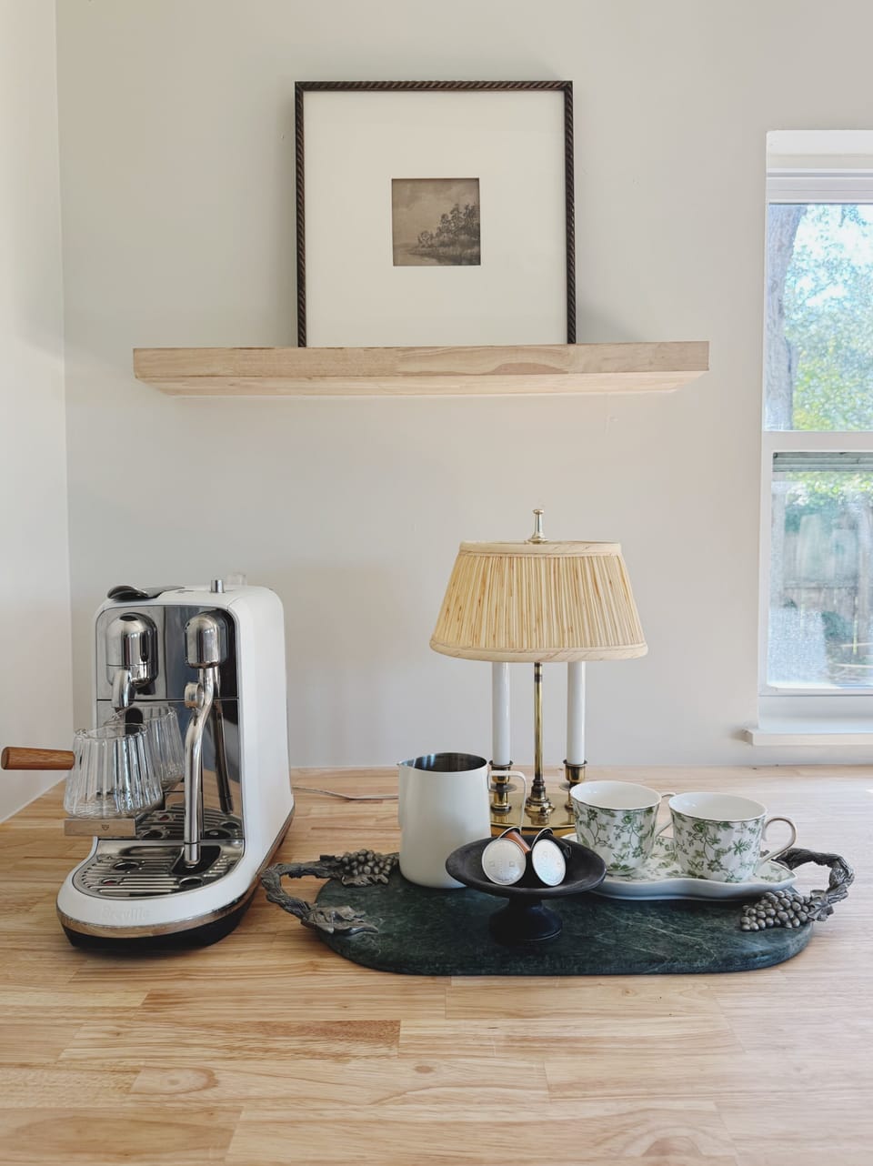 Cozy coffee nook with espresso machine, natural light, and elegant decor