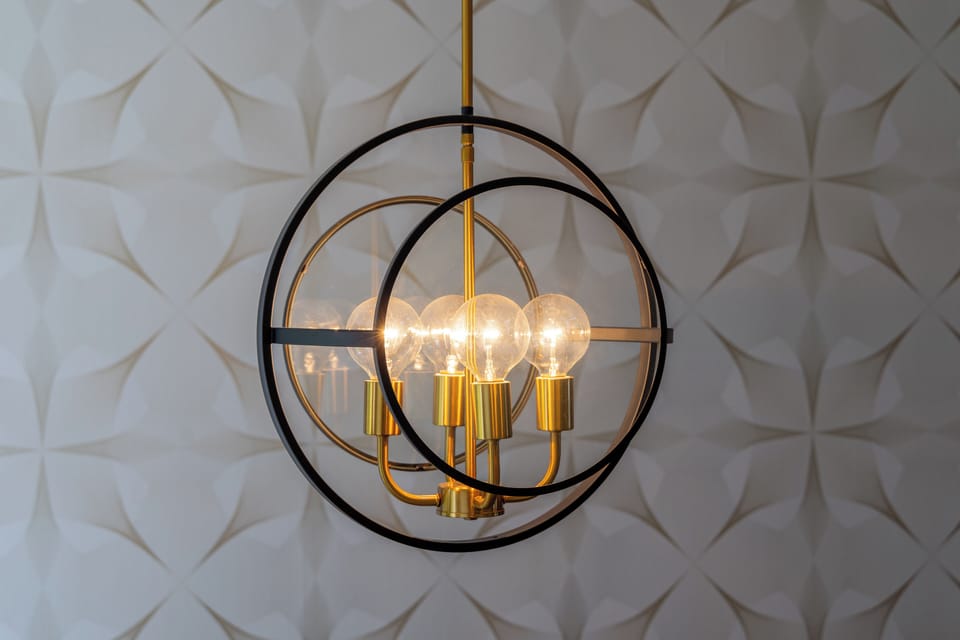 Modern lighting adds warmth while complementing the home's clean and welcoming design.
