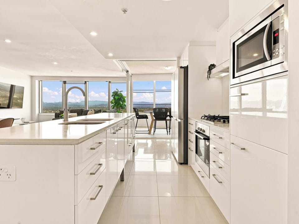 Fully equipped modern kitchen with generous bench space and appliances