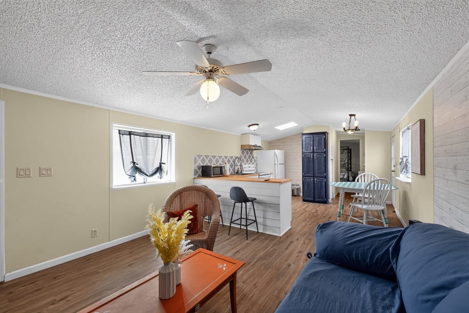 Furniture, Indoors, Living Room, Floor, Flooring
