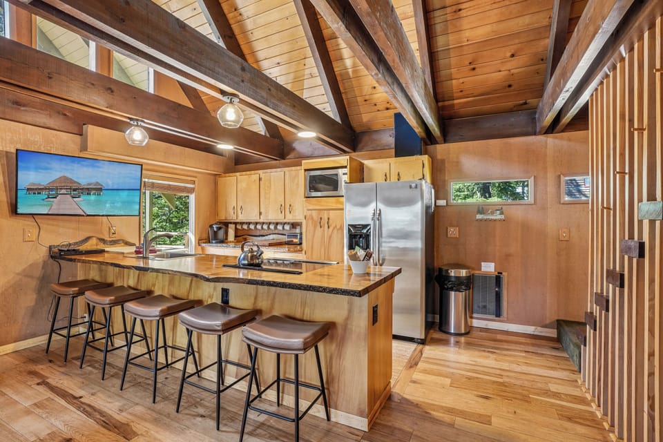 Kitchen: Rustic charm meets modern convenience with a stunning wood island and smart amenities!
