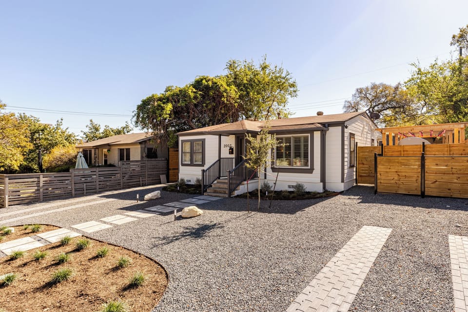 Enjoy the spacious yard and polished pathway in this stylish Austin retreat!