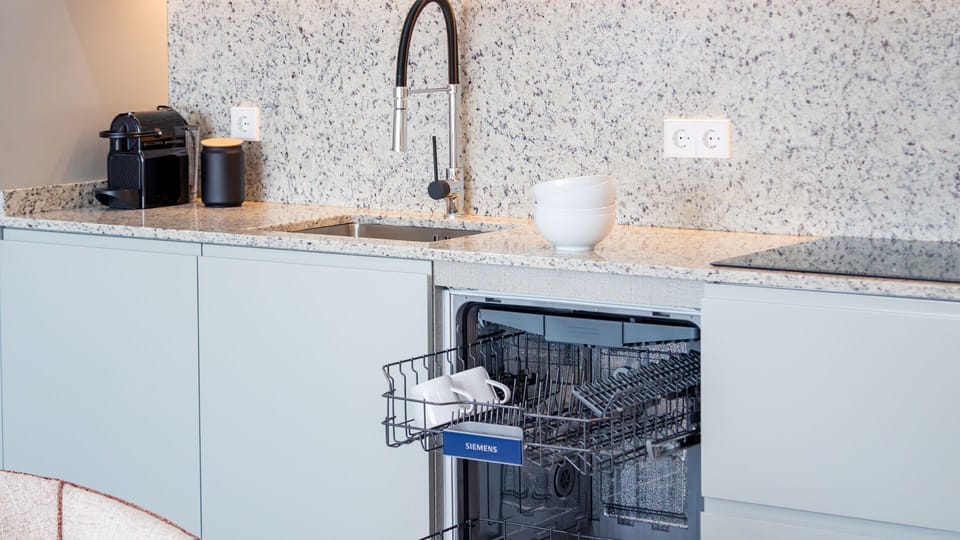 Cook with ease in a sleek, fully equipped kitchen designed for everyday convenience. #KitchenGoals #FullyEquipped #StayComfortably