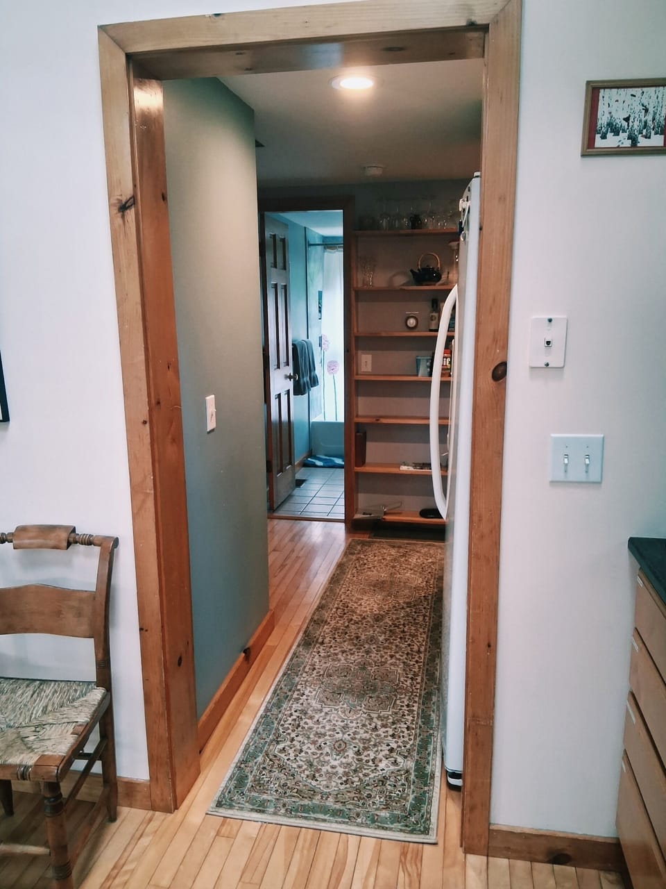 view from kitchen going to bathroom and two bedrooms
