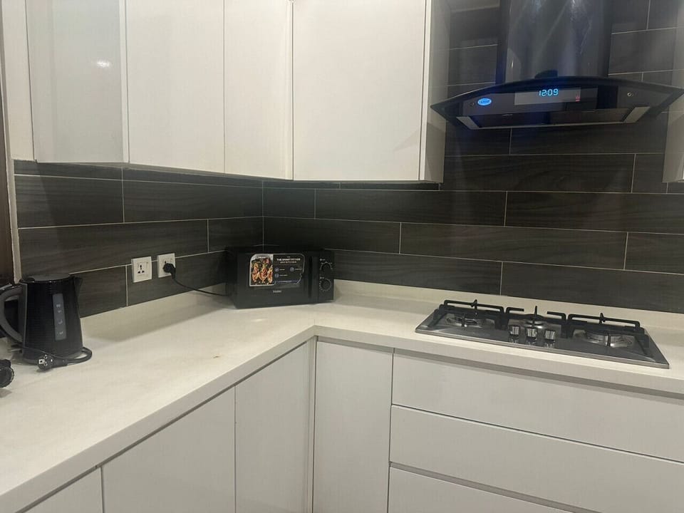 Kitchen equipped with kettle and microwave