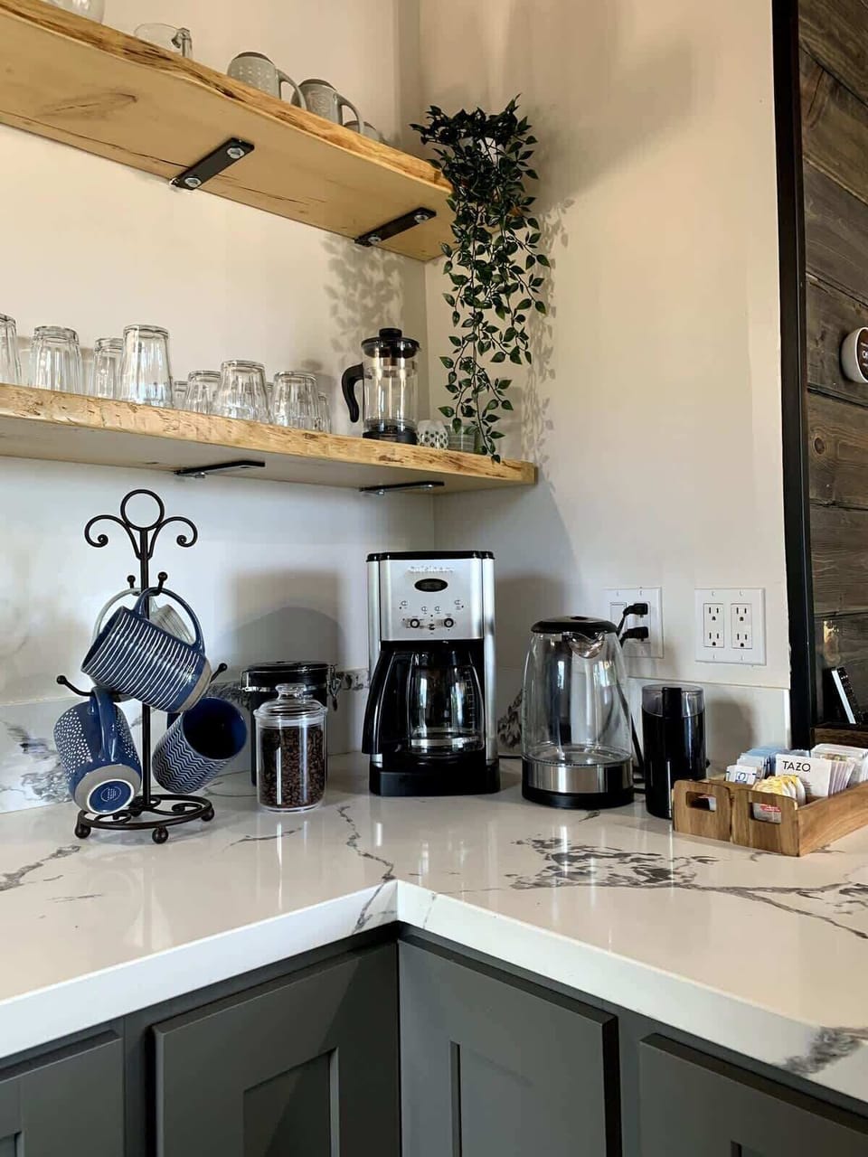 Coffee and tea station with French press, electric water kettle, coffee maker, fresh coffee beans and coffee grinder 