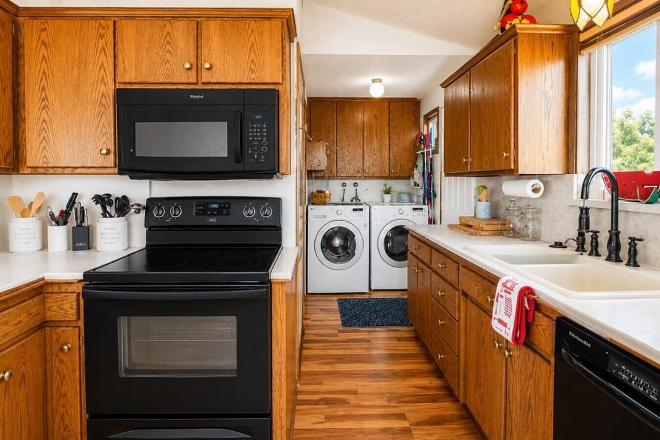 Full kitchen with the washer and dryer