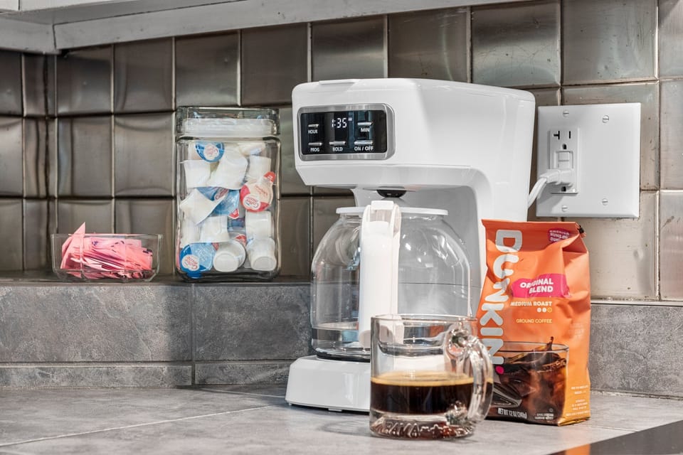 Convenient coffee station with stocked fixings for an easy morning brew