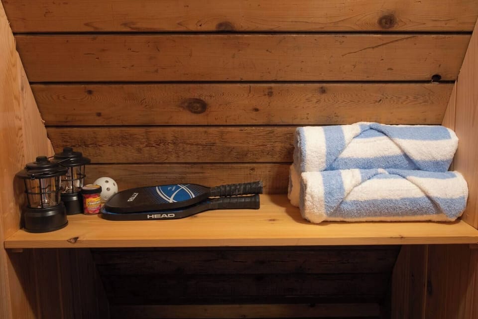 Pool towels and pickleball paddles provided for guest use