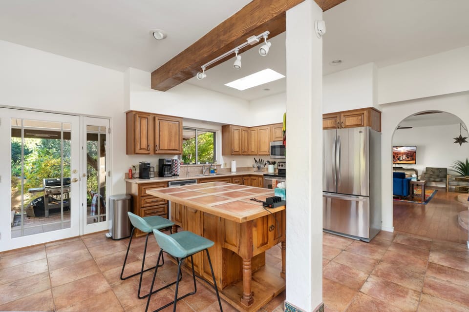 [Kitchen] Warm wood accents and bright skylights give this kitchen a cozy, welcoming feel.