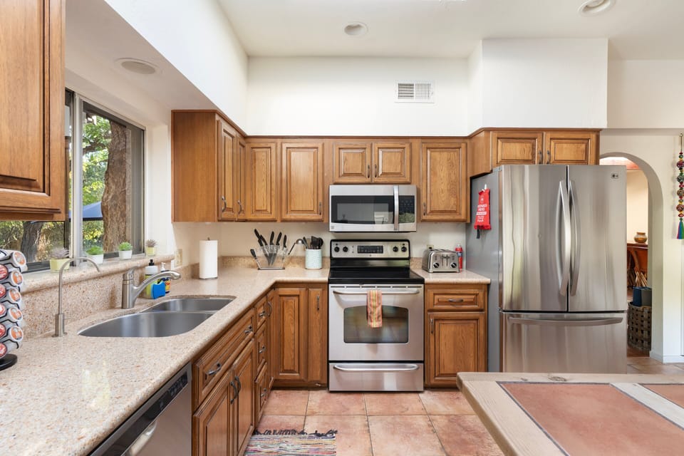 [Kitchen] You have ample room to move and dash around while preparing and cooking meals.