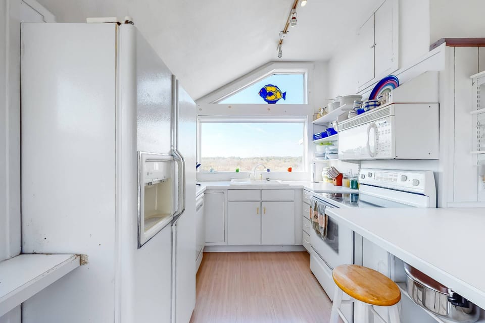 Fully stocked kitchen with marsh views