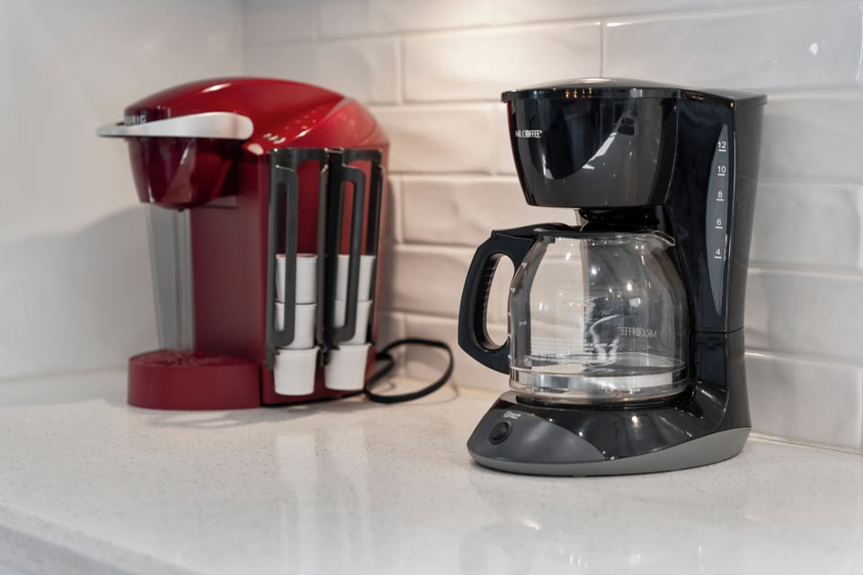 Start the morning with a fresh cup from the convenient coffee station, complete with single-serve and drip coffee makers for guests to use during their stay.