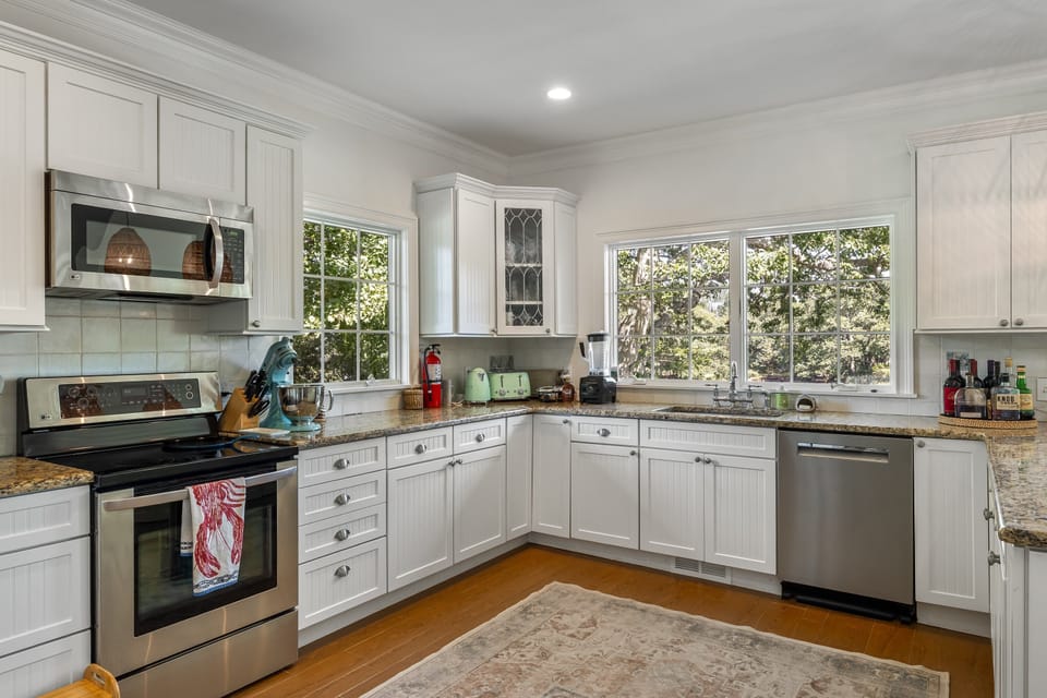 Full kitchen with ample counter and storage space.