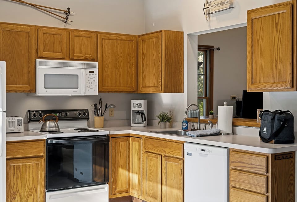 Kitchen featuring modern appliances and breakfast bar seating.