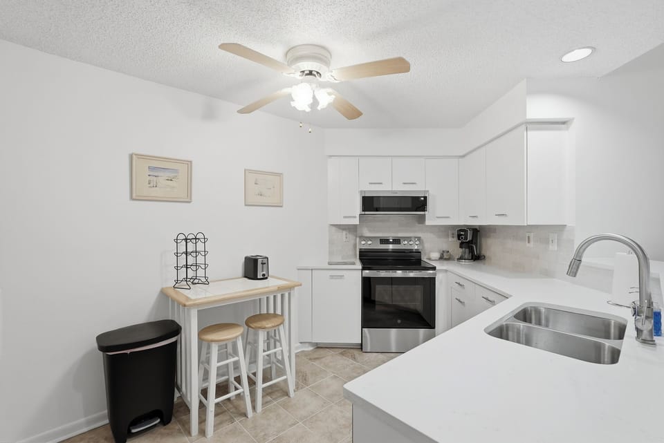 Fully equipped with modern appliances and essential cookware, the kitchen makes preparing meals easy, whether you're brewing your morning coffee or cooking a delicious meal for the group.
