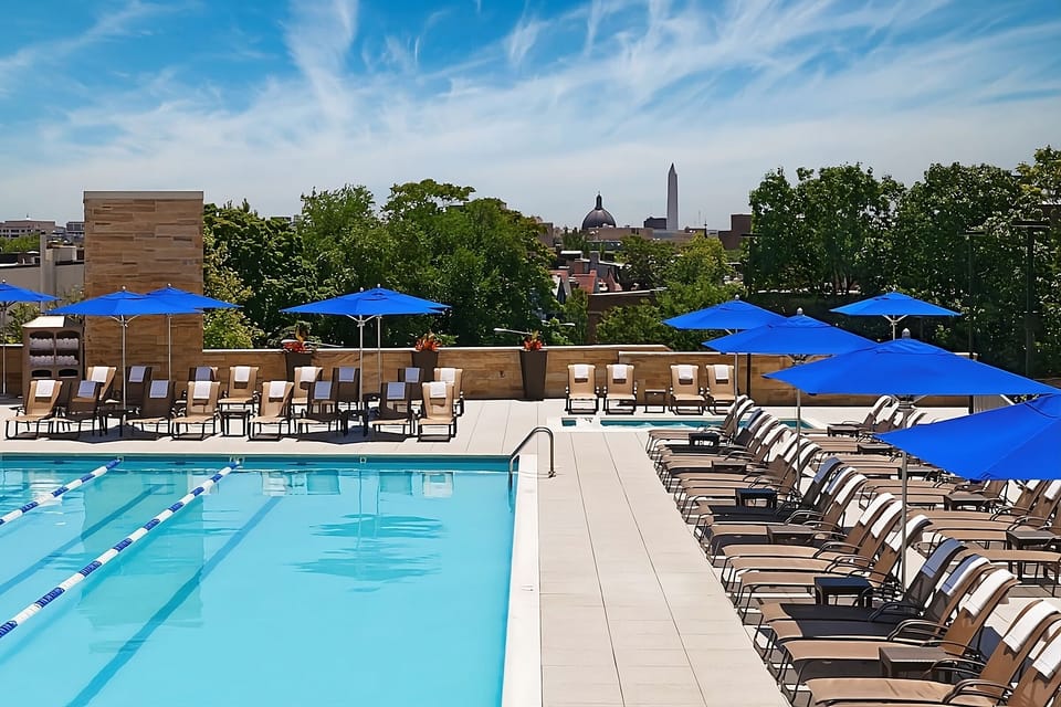 Unwind poolside with panoramic city views and crisp water.
