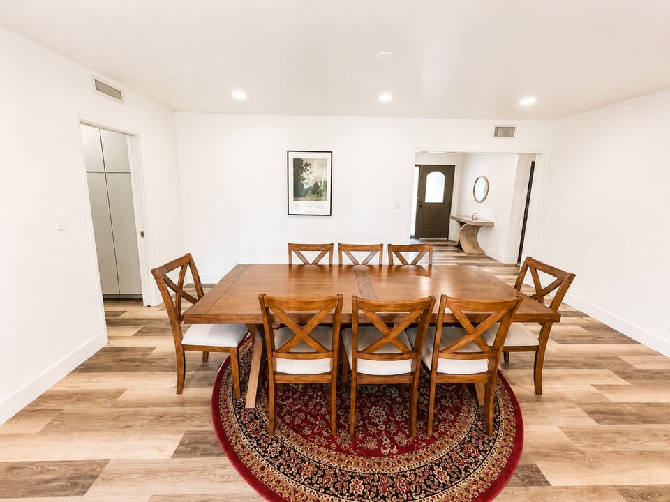 Spacious dining room with seating for 8 and a warm, inviting feel