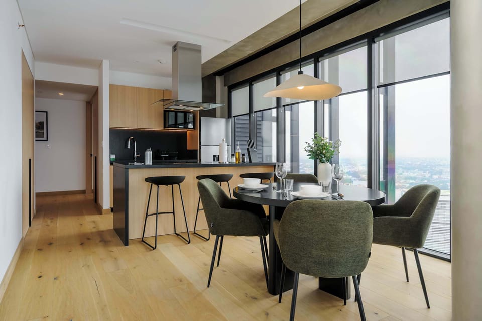 Elegant dining area for meals with beautiful city views.