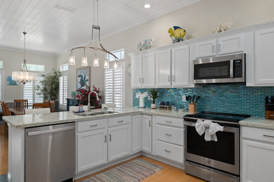The beautifully updated kitchen is fully equipped for everything from quick breakfasts to family feasts.