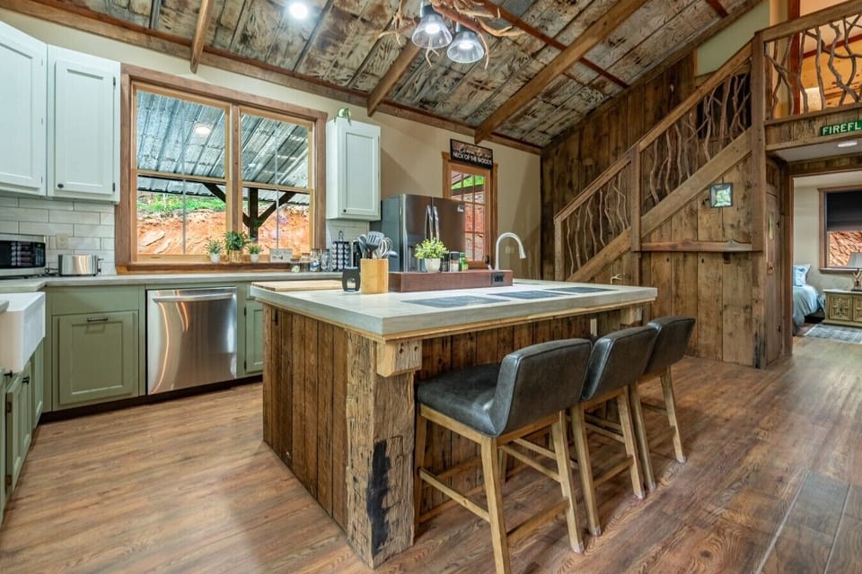 Gather around the oversized island in the fully equipped gourmet kitchen—the heart of the cabin.