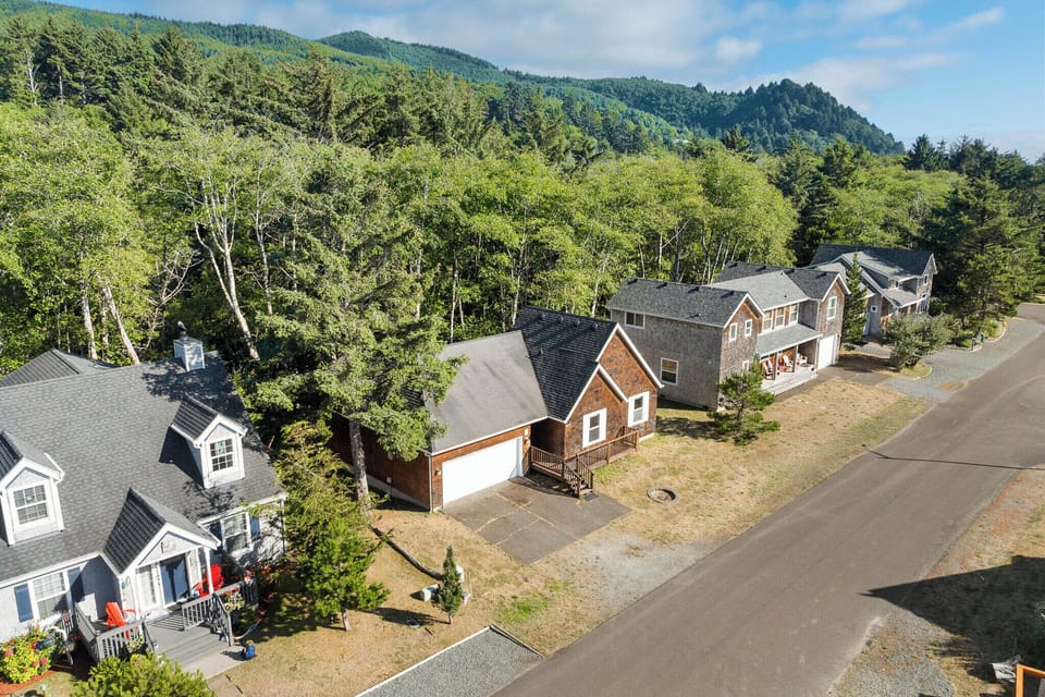 Nestled at the foot of forested mountains, this peaceful neighborhood captures the natural beauty surrounding the property. The scenic mountain backdrop and tranquil setting provide a serene arrival experience.