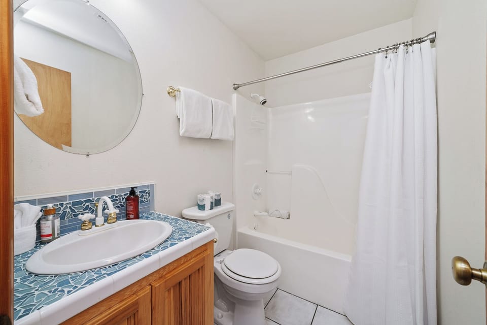 Freshen up in your private bathroom, complete with a tub-shower combo and crisp linens ready for your arrival.